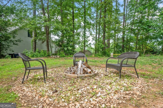 8035 Canter Ln, Alpharetta, GA 30009 - view of yard featuring an outdoor fire pit