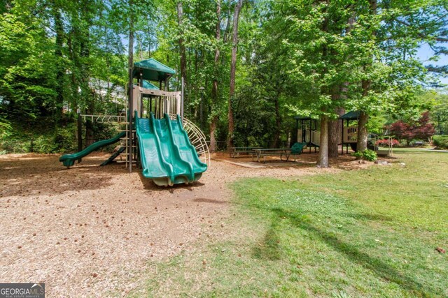 community play area with a lawn