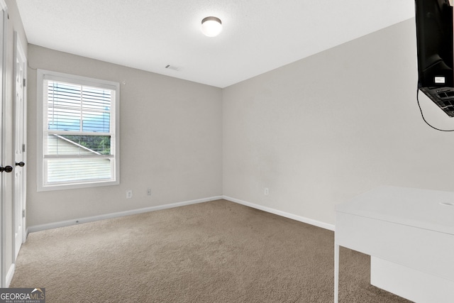 771 Franklin Mill Trce, Loganville, GA 30052 - empty room with carpet flooring and baseboards