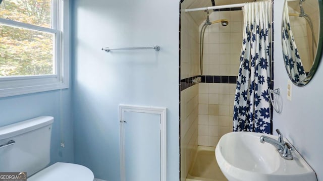 488 Mayapple Gln, Dawsonville, GA 30534 - full bathroom with a sink, tiled shower, and toilet