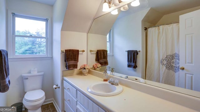 488 Mayapple Gln, Dawsonville, GA 30534 - bathroom featuring toilet, vanity, lofted ceiling, and baseboards
