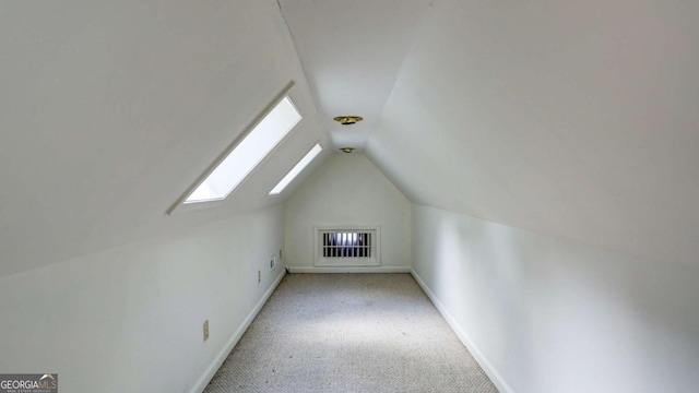 488 Mayapple Gln, Dawsonville, GA 30534 - bonus room featuring lofted ceiling, a skylight, carpet, and baseboards