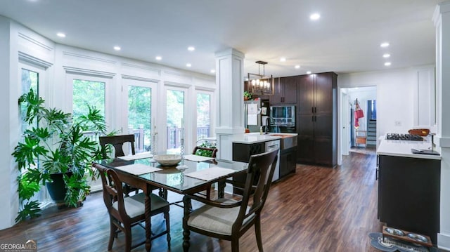 488 Mayapple Gln, Dawsonville, GA 30534 - dining space with recessed lighting, decorative columns, dark wood-type flooring, a decorative wall, and a chandelier
