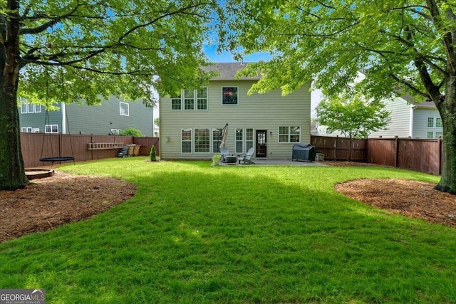 back of property with a patio