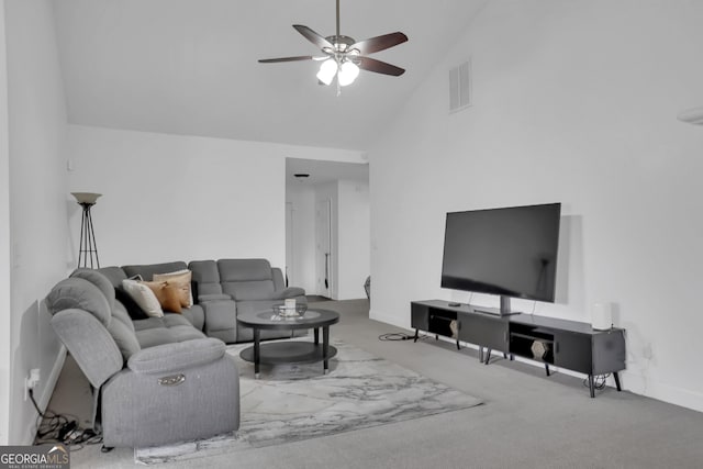 living room featuring a ceiling fan, high vaulted ceiling, carpet, and baseboards