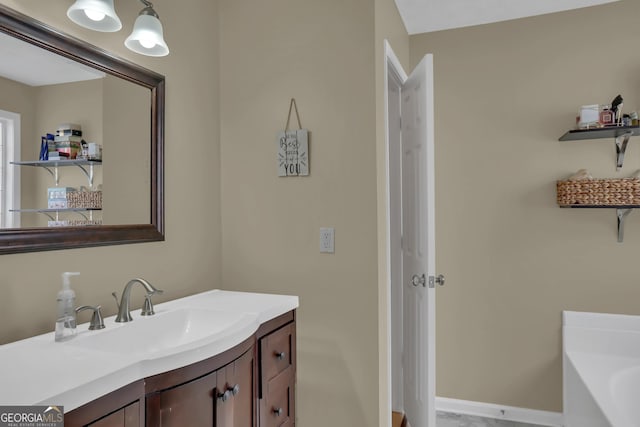 bathroom with a bath and vanity