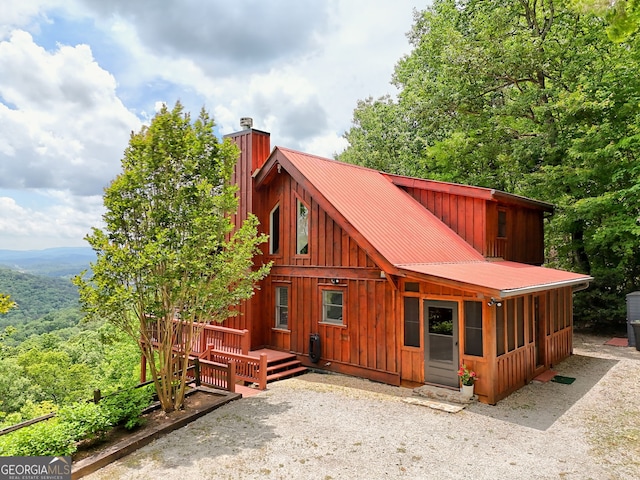 601 Black Bear Den Rd, Clayton, GA 30525 - chalet / cabin featuring a chimney, board and batten siding, and metal roof