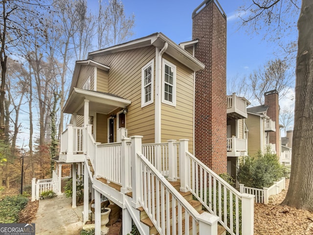2190 River Heights Ct SE, Marietta, GA 30067 - view of side of home with a chimney and cooling unit