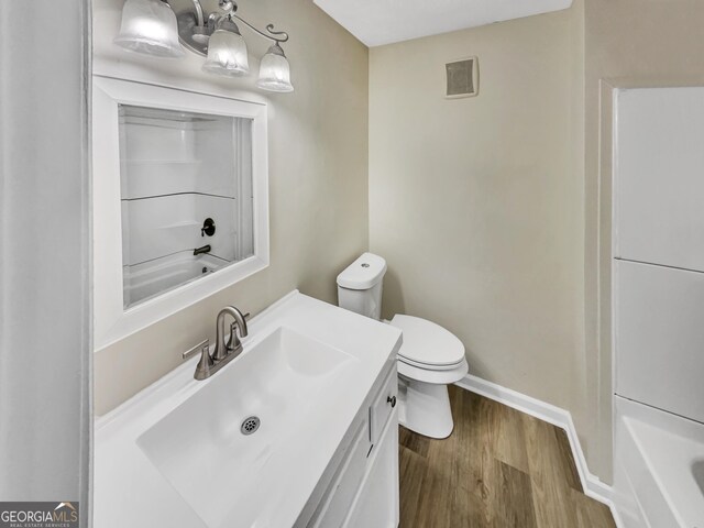 2190 River Heights Ct SE, Marietta, GA 30067 - full bathroom with vanity, wood finished floors, and bathtub / shower combination