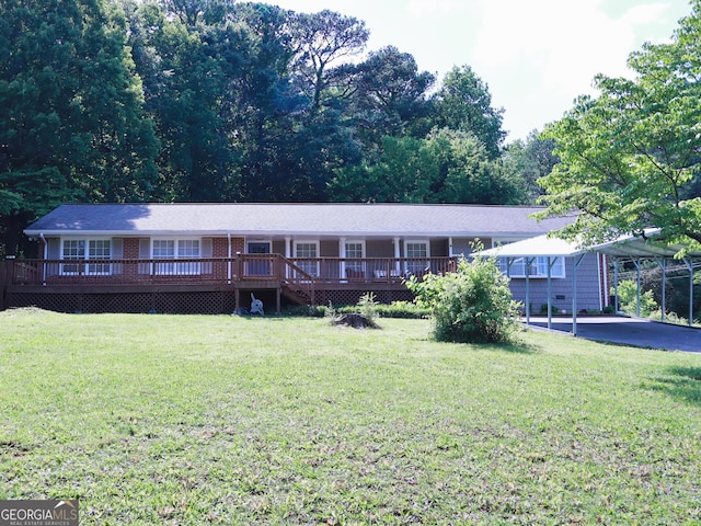 1315 Walston St, Dalton, GA 30720 - ranch-style house featuring a front yard, a deck, a detached carport, and brick siding