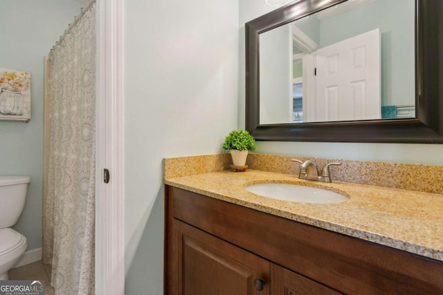 full bath featuring toilet and vanity