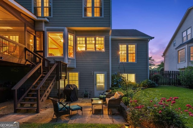 back of house with stairs and a patio area