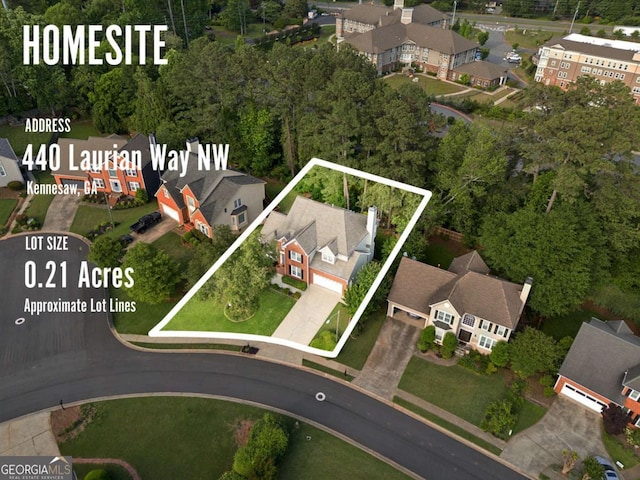 aerial view of property and surrounding area with property parcel outlined and nearby suburban area