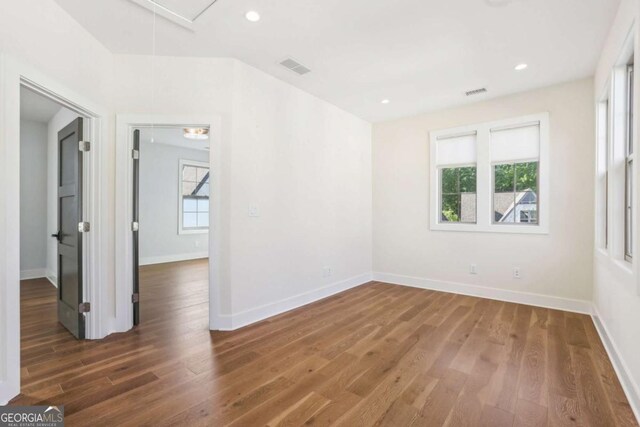 190 Arbor Garden Cir, Newnan, GA 30265 - empty room featuring attic access, wood finished floors, baseboards, and recessed lighting