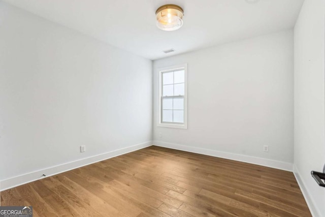 190 Arbor Garden Cir, Newnan, GA 30265 - spare room featuring baseboards and wood finished floors