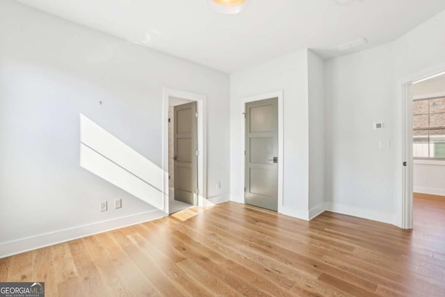 190 Arbor Garden Cir, Newnan, GA 30265 - spare room featuring wood finished floors and baseboards
