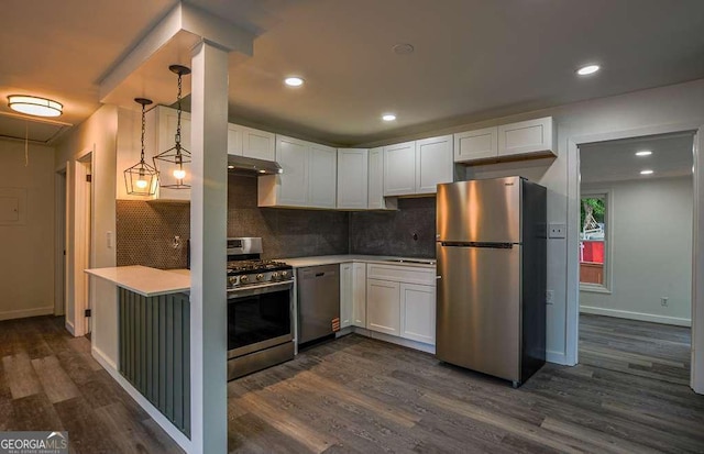 1772 Martin Pl SE, Smyrna, GA 30080 - kitchen with stainless steel appliances, dark wood-style floors, light countertops, white cabinets, and recessed lighting