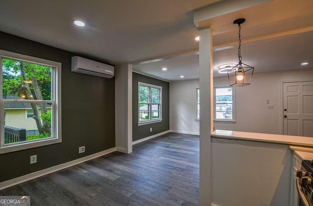 1772 Martin Pl SE, Smyrna, GA 30080 - unfurnished dining area with a wall mounted air conditioner, dark wood-style flooring, baseboards, and recessed lighting