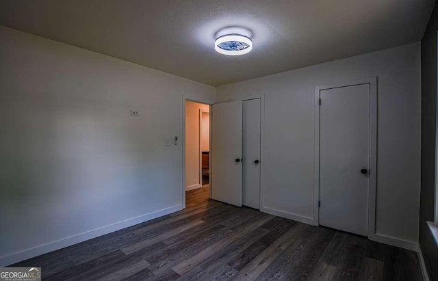1772 Martin Pl SE, Smyrna, GA 30080 - unfurnished bedroom with dark wood-type flooring and baseboards