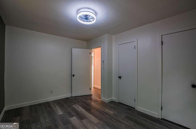 1772 Martin Pl SE, Smyrna, GA 30080 - unfurnished bedroom with wood finished floors, baseboards, and a textured ceiling
