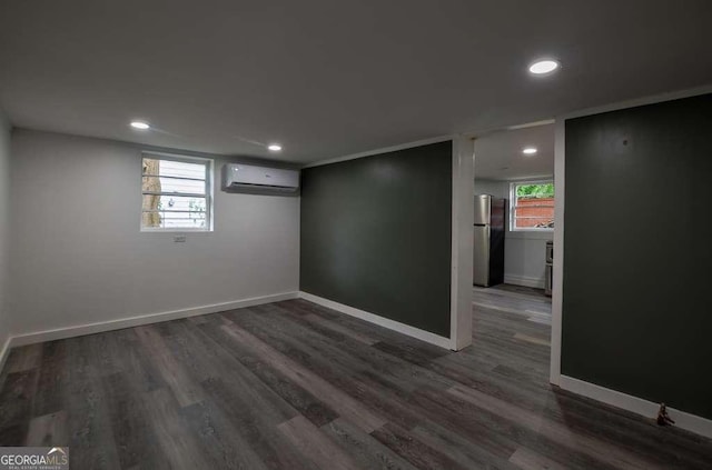 1772 Martin Pl SE, Smyrna, GA 30080 - below grade area featuring freestanding refrigerator, a wall mounted AC, baseboards, dark wood-type flooring, and recessed lighting