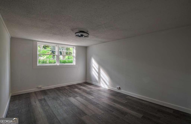 1772 Martin Pl SE, Smyrna, GA 30080 - spare room with dark wood-style flooring, a textured ceiling, and baseboards