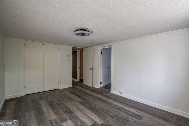1772 Martin Pl SE, Smyrna, GA 30080 - unfurnished bedroom with dark wood-type flooring, a textured ceiling, and baseboards