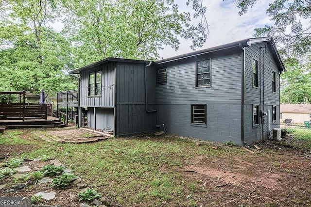 1772 Martin Pl SE, Smyrna, GA 30080 - rear view of property featuring a wooden deck, central AC unit, and fence