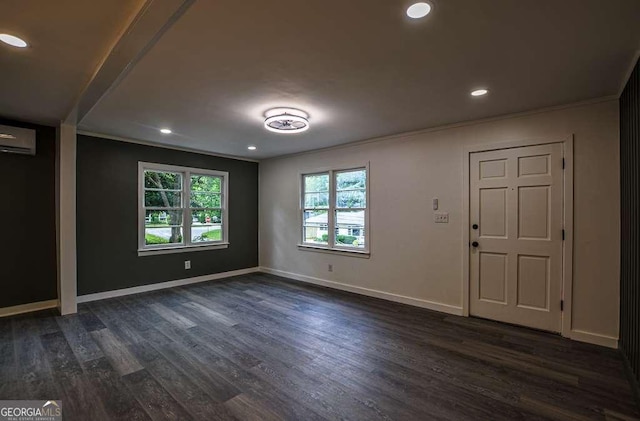 1772 Martin Pl SE, Smyrna, GA 30080 - empty room with dark wood-style floors, baseboards, an AC wall unit, recessed lighting, and crown molding