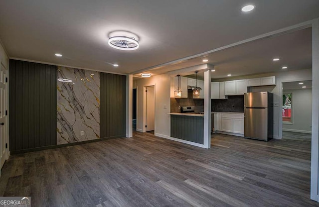 1772 Martin Pl SE, Smyrna, GA 30080 - kitchen with freestanding refrigerator, white cabinetry, open floor plan, dark wood finished floors, and recessed lighting