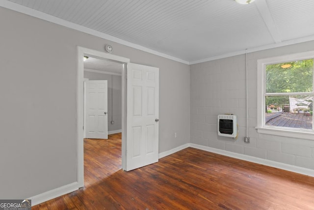 unfurnished living room featuring heating unit, dark wood-style floors, baseboards, and crown molding