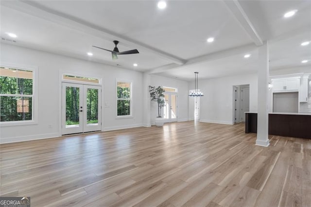 5567 Tyree Rd, Winston, GA 30187 - unfurnished living room with plenty of natural light, a ceiling fan, light wood-style flooring, recessed lighting, and beamed ceiling