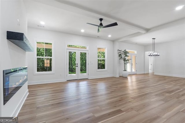 5567 Tyree Rd, Winston, GA 30187 - unfurnished living room featuring recessed lighting, light wood-style floors, a ceiling fan, a chandelier, and french doors