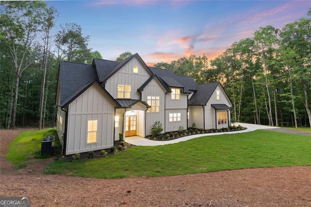 5567 Tyree Rd, Winston, GA 30187 - modern inspired farmhouse featuring board and batten siding, french doors, a lawn, and central AC