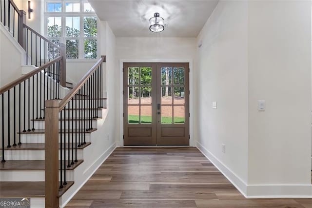 5567 Tyree Rd, Winston, GA 30187 - entrance foyer featuring french doors, stairs, and wood finished floors