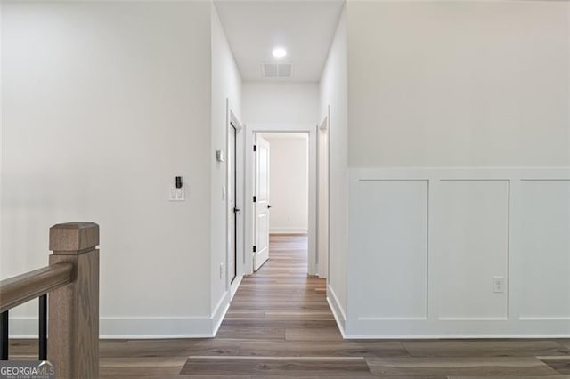 5567 Tyree Rd, Winston, GA 30187 - corridor with wood finished floors, a decorative wall, and a wainscoted wall
