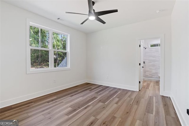 5567 Tyree Rd, Winston, GA 30187 - spare room with light wood finished floors, ceiling fan, and baseboards