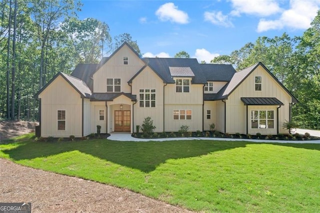 5567 Tyree Rd, Winston, GA 30187 - view of front of home with a front lawn, a standing seam roof, french doors, and metal roof