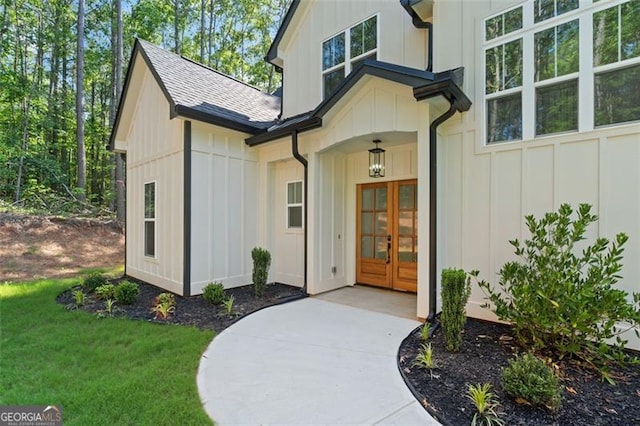 5567 Tyree Rd, Winston, GA 30187 - doorway to property with french doors, board and batten siding, a shingled roof, and a yard