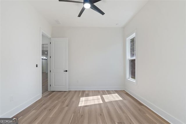 5567 Tyree Rd, Winston, GA 30187 - empty room with light wood-style floors, baseboards, and ceiling fan