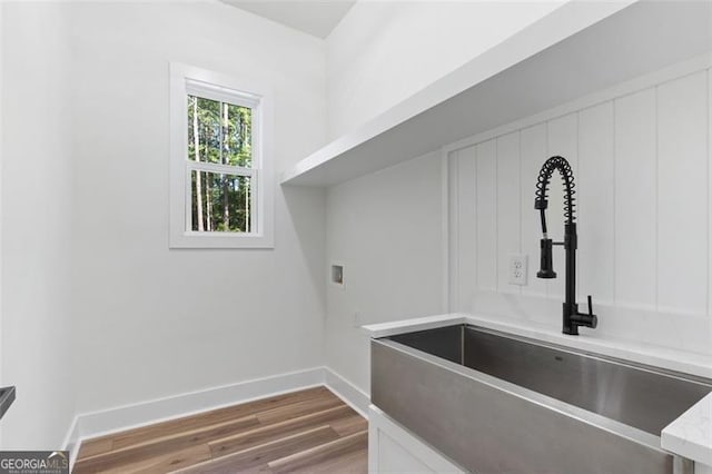 5567 Tyree Rd, Winston, GA 30187 - laundry room featuring wood finished floors, baseboards, and washer hookup