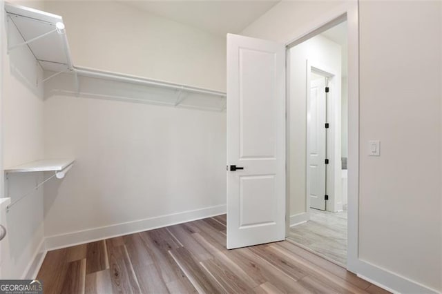 5567 Tyree Rd, Winston, GA 30187 - walk in closet with wood finished floors