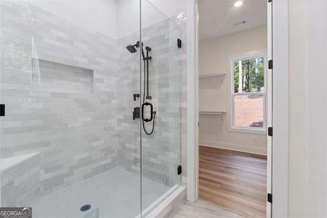 5567 Tyree Rd, Winston, GA 30187 - bathroom with a shower stall, baseboards, wood finished floors, and recessed lighting