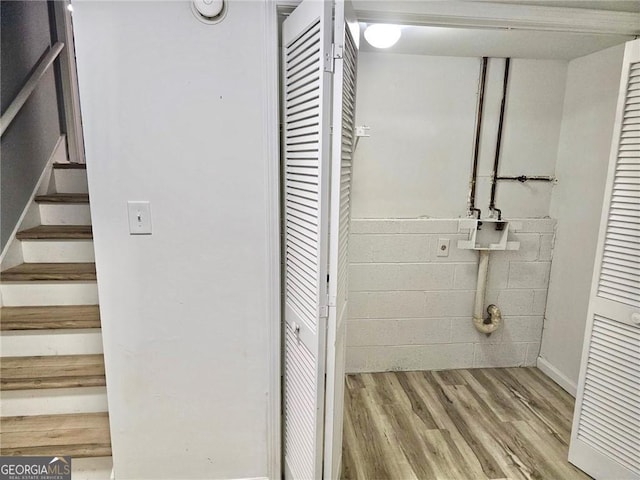 3045 Revere Cir, Snellville, GA 30039 - basement featuring wood finished floors and stairway