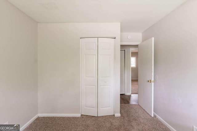 2499 Shiloh Dr, Decatur, GA 30034 - unfurnished bedroom featuring carpet floors, baseboards, and a closet