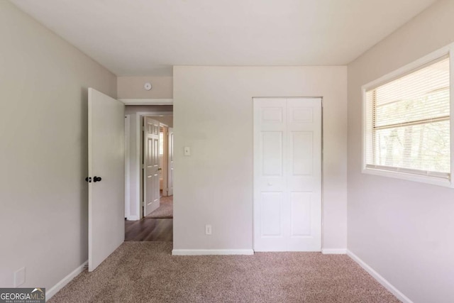2499 Shiloh Dr, Decatur, GA 30034 - unfurnished bedroom with carpet flooring, baseboards, and a closet