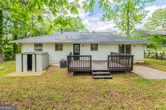 2499 Shiloh Dr, Decatur, GA 30034 - back of house featuring a deck, central air condition unit, a yard, a shed, and an outdoor structure