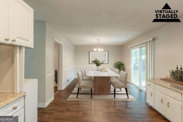 2499 Shiloh Dr, Decatur, GA 30034 - dining area with dark wood-type flooring, a chandelier, and baseboards