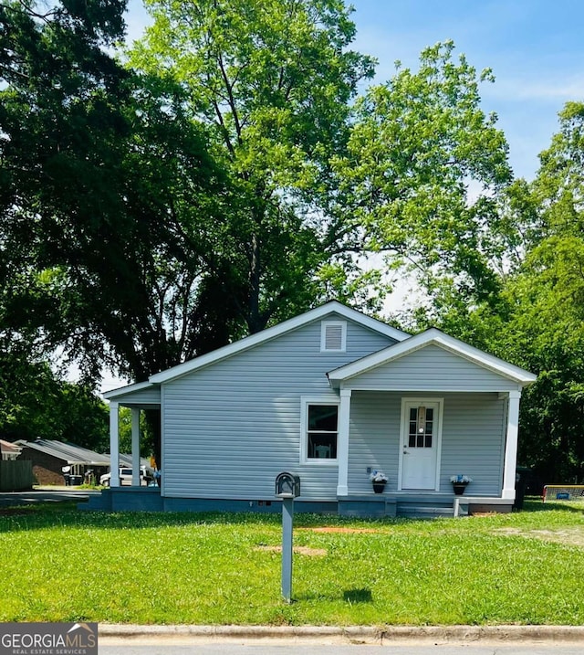 view of front facade featuring a front yard and crawl space
