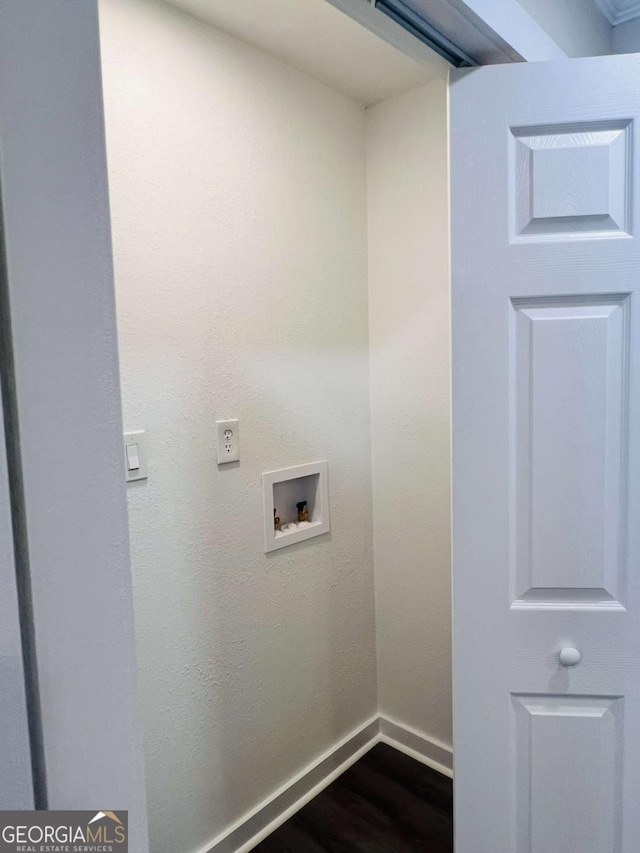 laundry room with washer hookup, dark wood-type flooring, and baseboards
